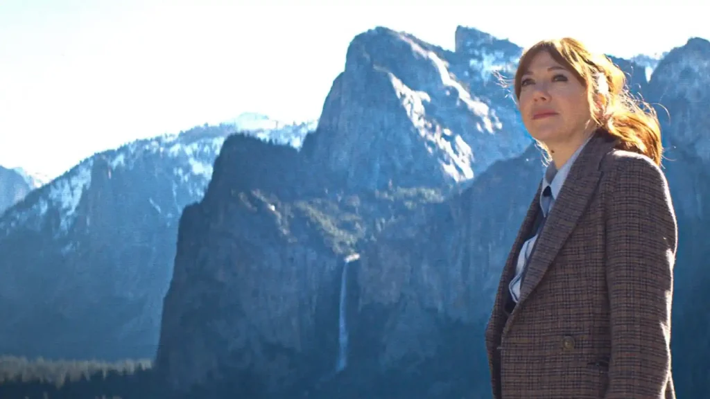 Cunk on Life - a woman standing in front of a mountain